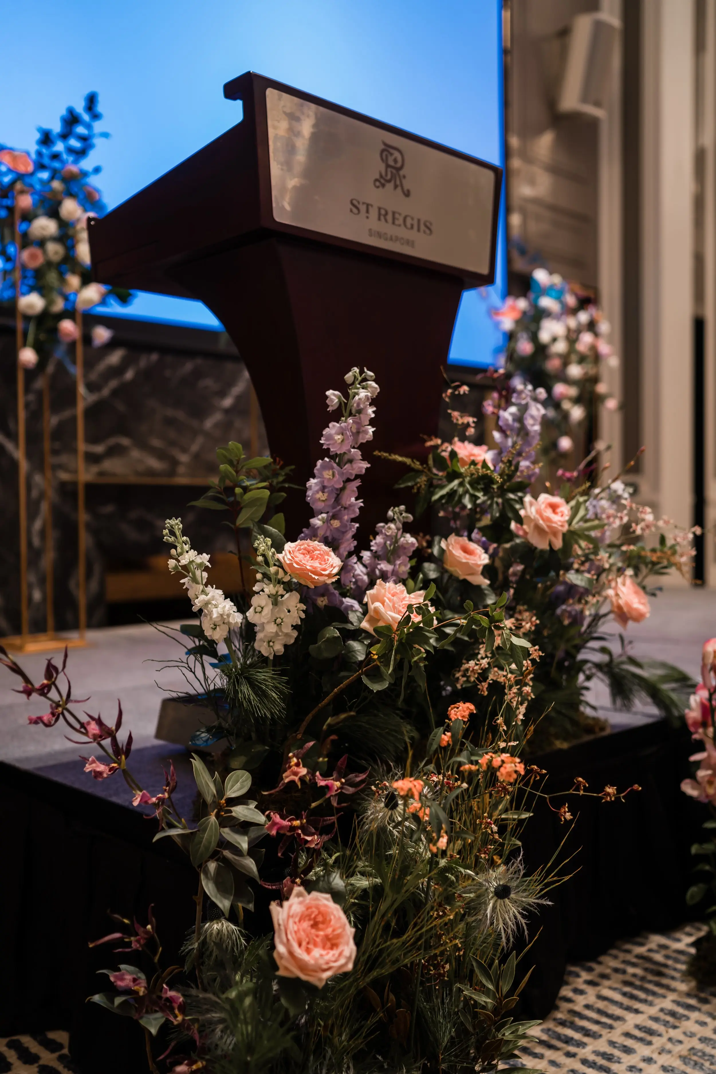Base of the stage was decorated with lush florals to elevate the overall look of the stage, complementing the floral frames styled by CC Lee.