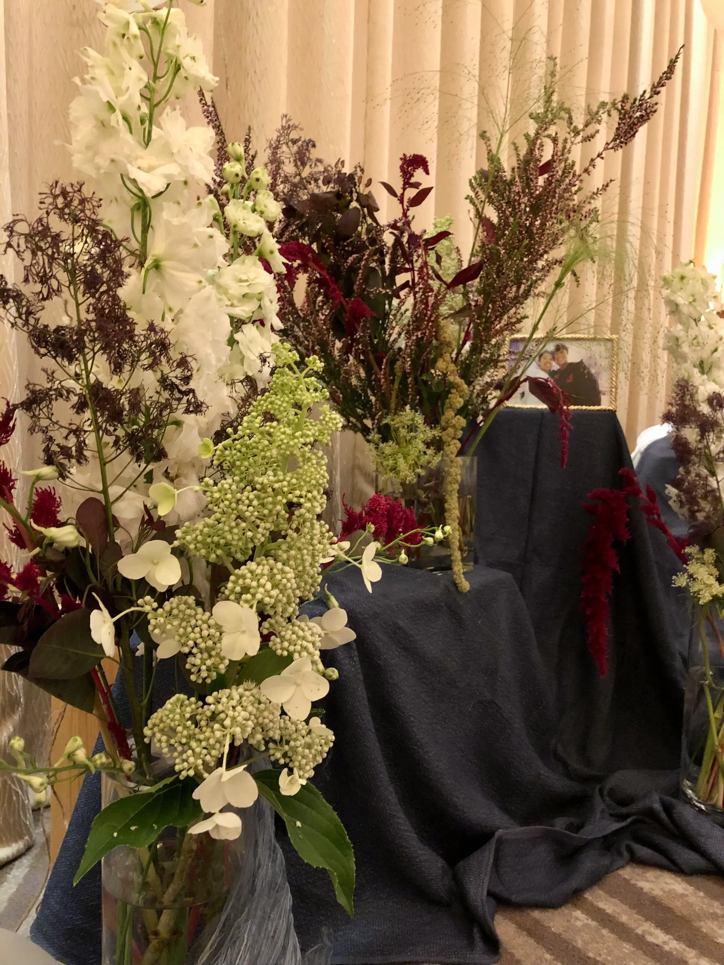An abstract representation of the sea and the textures observed on the coral reef with florals such as smokebush, amaranthus and thryptomene.